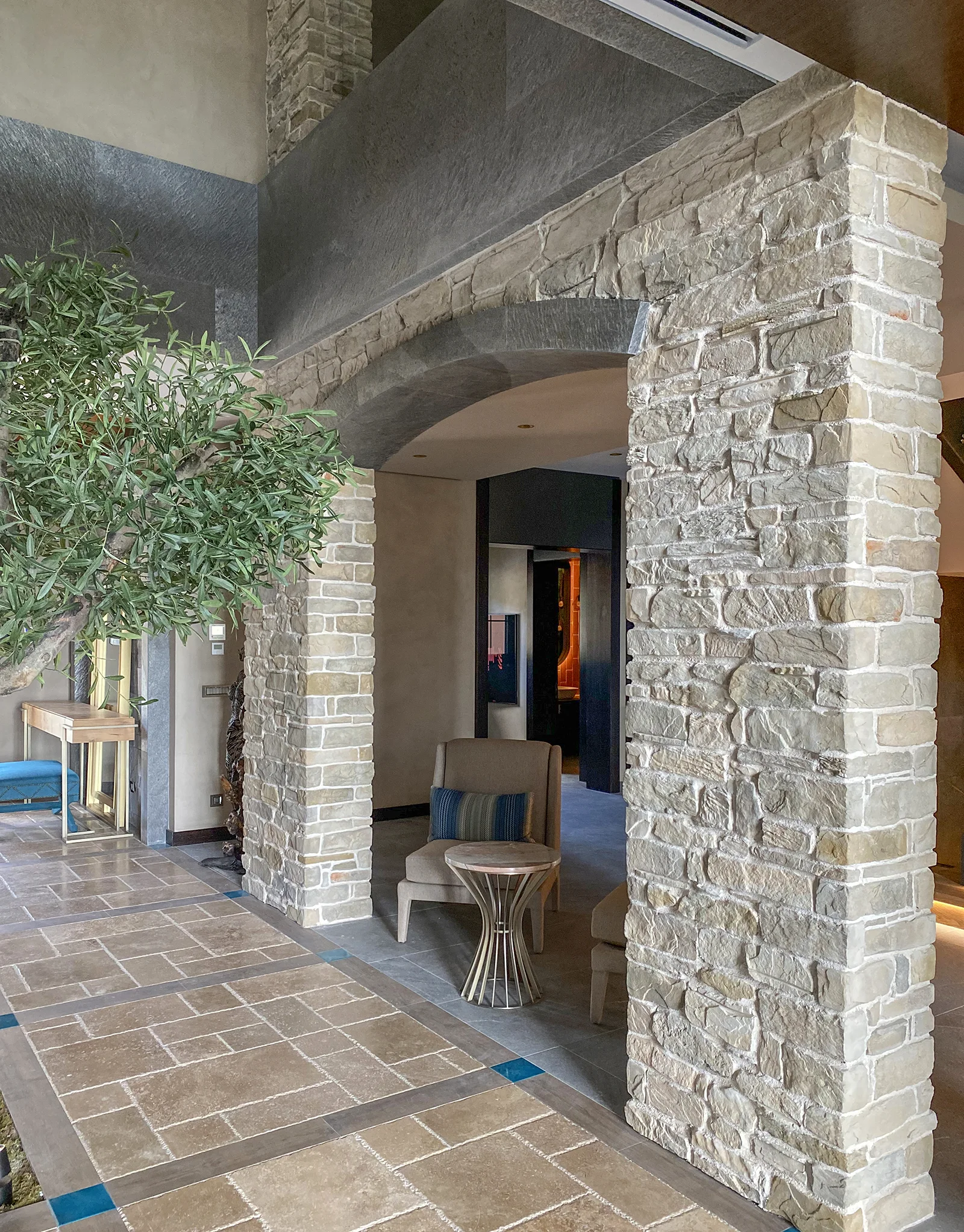 arched stone wall and seating area