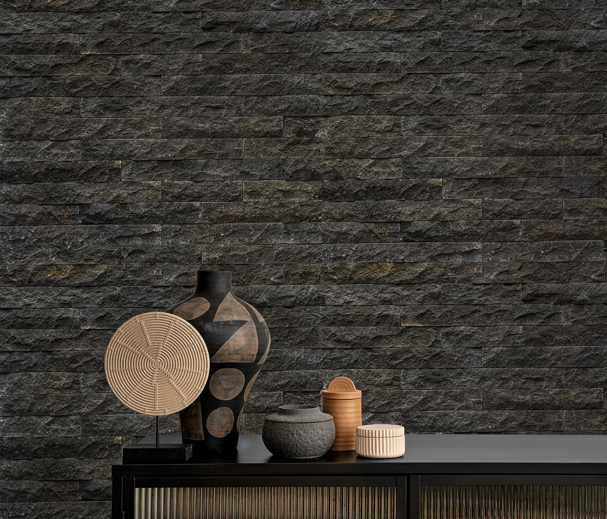 Anthracite color stone wall and some objects front of it