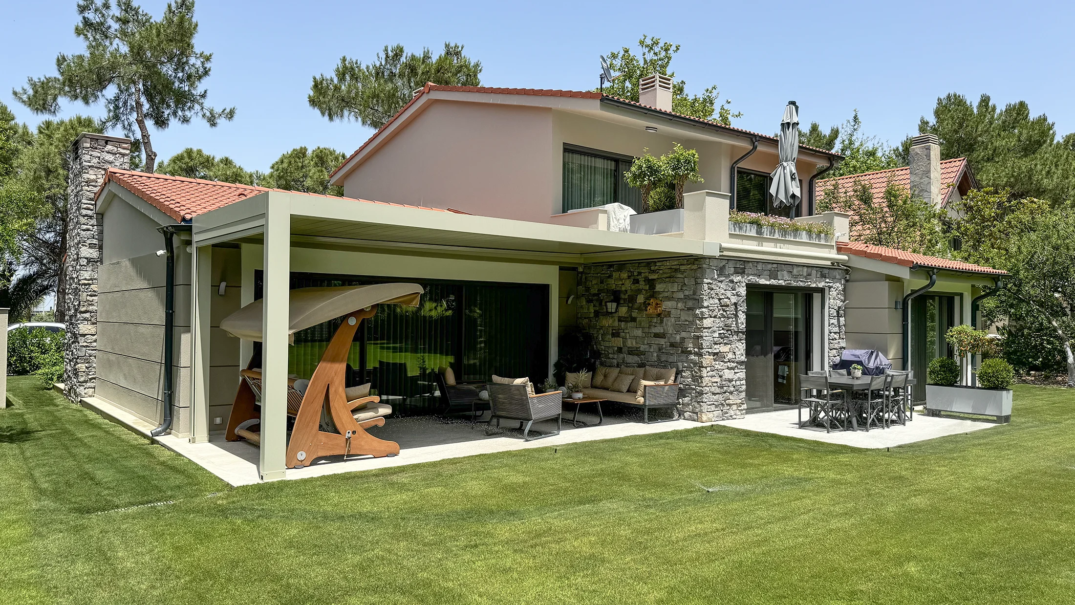 A spectacular house in a forest with stone veneer on exterior walls