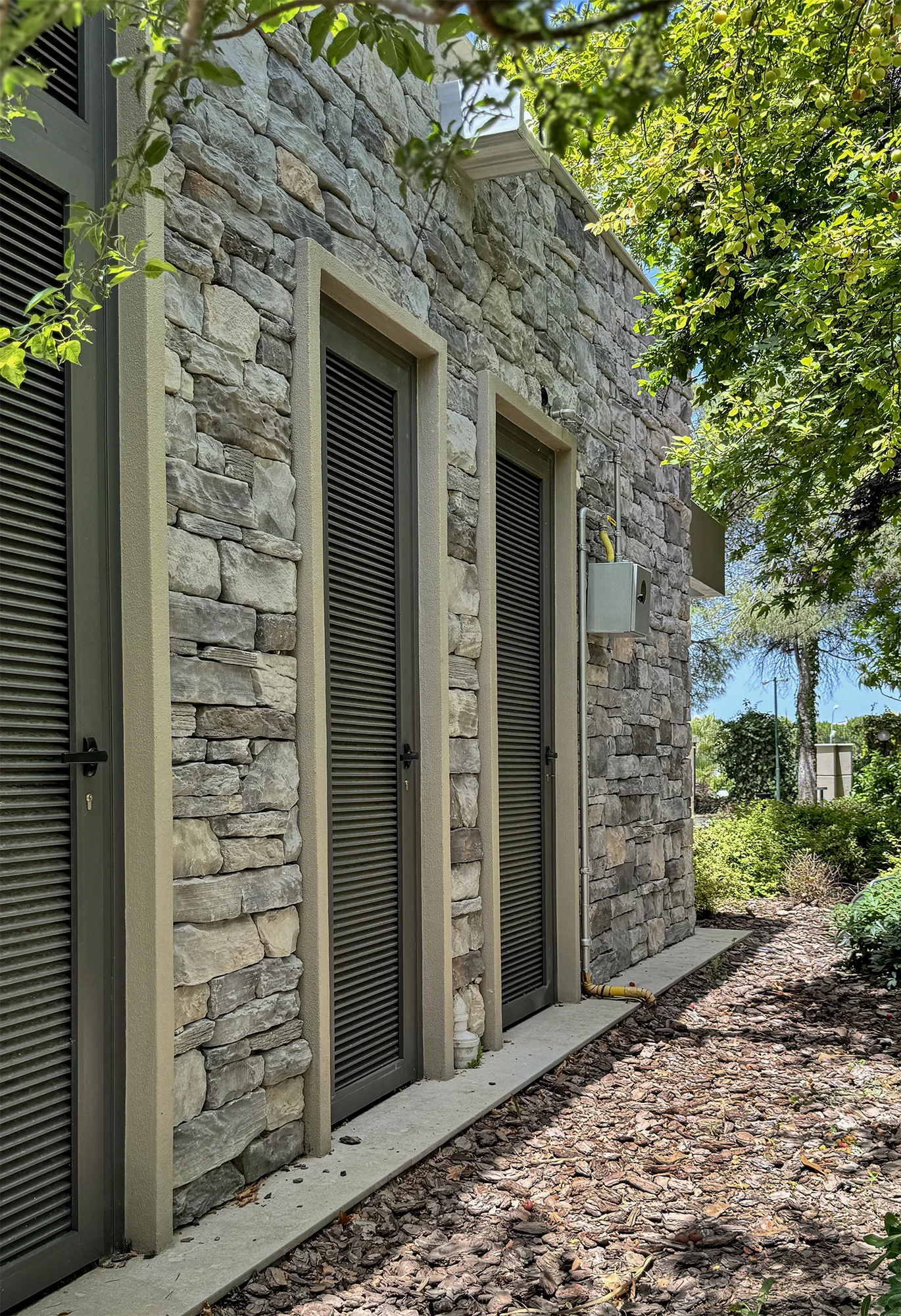 A spectacular house in a forest with stone veneer on exterior walls